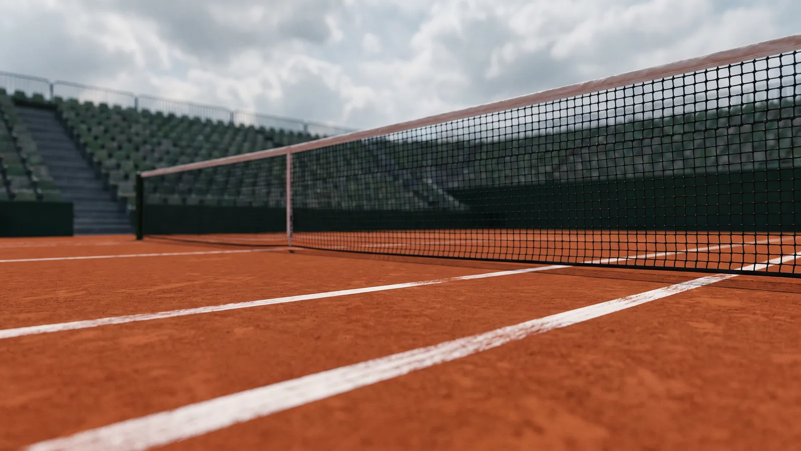 Sandplatz mit Tennisnetz im Stadion